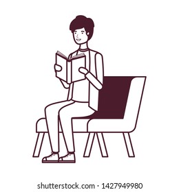 man sitting on chair with book in hands