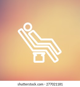 Man sitting on the dental chair icon thin line for web and mobile, modern minimalistic flat design. Vector white icon on gradient mesh background.