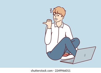 Man sitting on floor with laptop and looking back pointing finger doing college assignment. Casual guy freelancer enjoys remote work for internet companies or start-ups. Flat vector design 