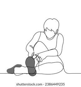 man sitting on the floor ties a lace on a sneaker - one line art vector. concept putting on shoes, trying on shoes, tying shoelaces training