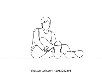 man sitting on the floor tying the laces on sneakers - one line drawing vector. sportsman training concept 