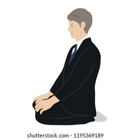 A man in sitting on his heels
