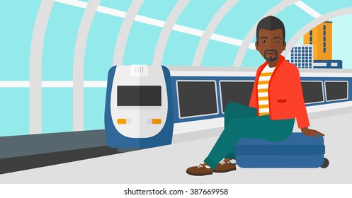 Man sitting on railway platform.