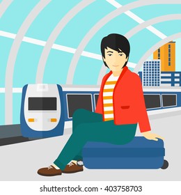 Man sitting on railway platform.