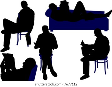 man sitting and reading newspaper