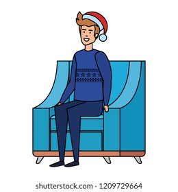 man sitting in sofa with christmas sweater and hat