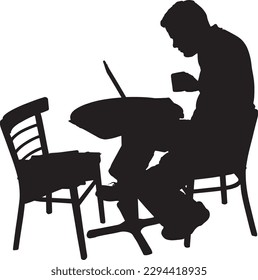 A man is sitting at a table with a laptop and a cup of coffee.