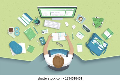 Man sitting at the table and takes notes. Workplace Desktop Workspace Armchair, office supplies, monitor, books, notebook, headphones, phone, glasses, pen, bag, coffee, donut, cap. Vector Top view 