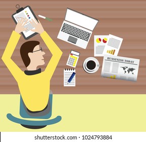 a man sleeping on the office table view on top