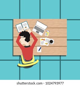 a man sleeping on the office table view on top