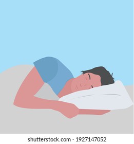 man sleeps on a pillow on blue background