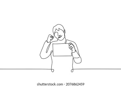 man smiling showing horizontal blank poster or sheet of paper and clenched fist encouraging gesture - one line drawing vector. the concept of "you can do it", "I believe in you", "stay strong" 