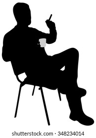 man smoking cigarette and drinking coffee