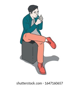 a man is smoking while sitting on the chair