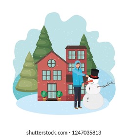 man with snowman and house in winter 