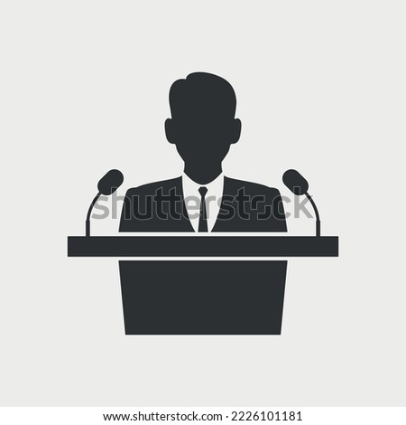Man Speaker talking into microphones at podium tribune. Official person in suit during public speech, communication with people. 
