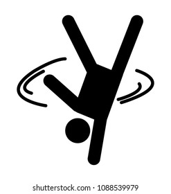 
A man spinning over his hand making a breakdance move 
