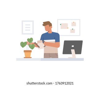 A man is spraying plants on his desk