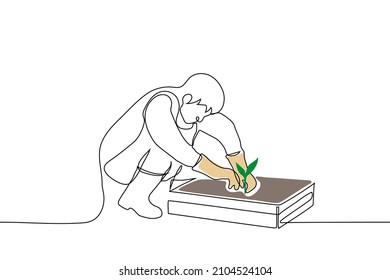 hombre ocupando posiciones ocupadas frente a la caja de tierra y cavando plántulas verdes - un vector de dibujo de una línea. concepto de huerto casero, plántulas trasplantadas, planta