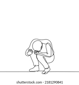 man squatting with his head down and hugging his knees - one line drawing vector. concept sobs, impotence, despair