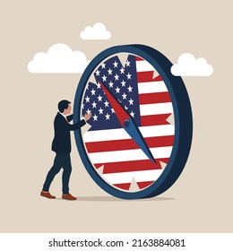 Man Stand With Compass With USA National Flag. World And United States Economic Direction After Presidential Election, Direction Of US Federal Reserve, Financial Crisis.