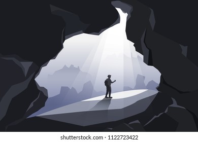 Man standing in big caves