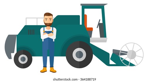 Man standing with combine on background.