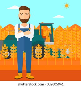 Man standing with combine on background.