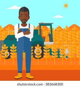 Man standing with combine on background.