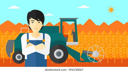 Man standing with combine on background.