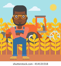 Man standing with combine on background.