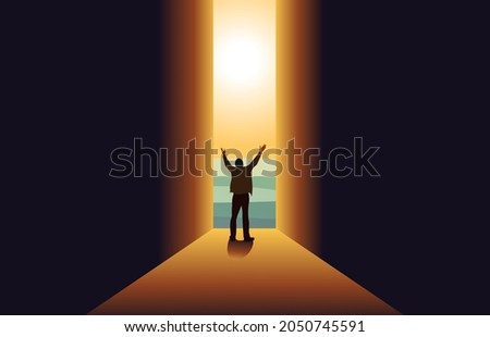 A man standing in Dark with hands raised  at the end of the Tunnel concept for religion, worship, prayer ,New Possibilities, Hope,Overcome Business Problems, Solution Finding.