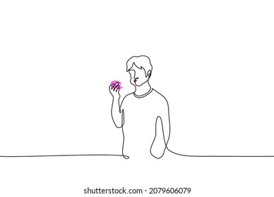 man is standing eating donut, on his face there is pink icing from donut - one line drawing vector. concept of eating sweets, sweet tooth eating donut 