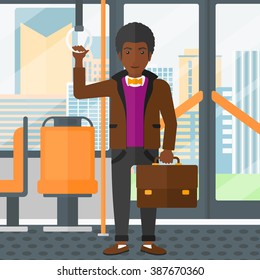 Man standing inside public transport.