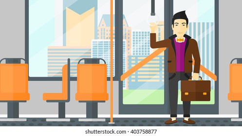 Man standing inside public transport.