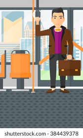Man standing inside train.