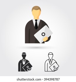 man standing with laptop
