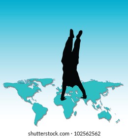 man standing on his hands on the world map