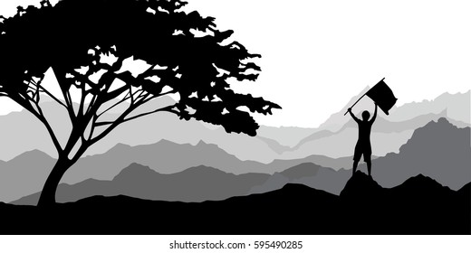 man standing on a mountaintop holding a flag