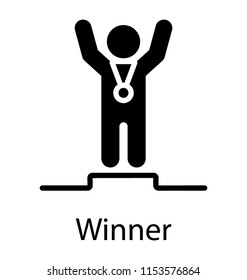 
Man standing on podium with both hands up, wearing medal, conceptualizing winner 

