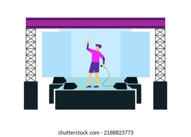 man standing on stage holding mic