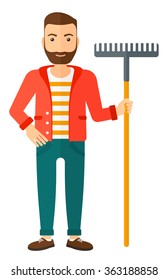 Man standing with rake.