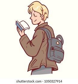 man standing and reading book