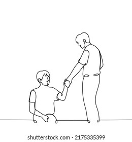 man standing stretching out his hand to sitting on the floor or ground - one line drawing vector. concept of helping those in need, helping loved ones, compassion and empathy svg