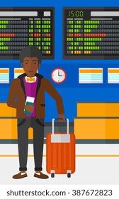 Man standing with suitcase and holding ticket.