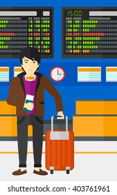 Man standing with suitcase and holding ticket.