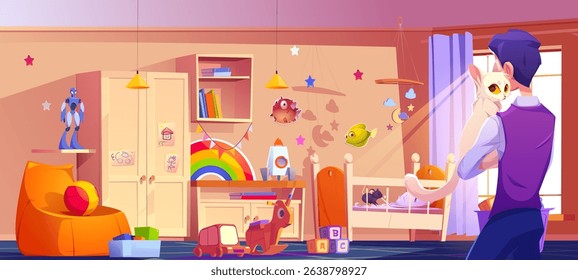 Man stands with back holding white cat in colorful kid nursery where mouse chewing on bedding in crib. Room with wooden furniture, bookshelf filled with toys scattered below, decorated with stars