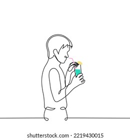 man stands or carries a glass with a cocktail with a straw and an umbrella - one line drawing vector