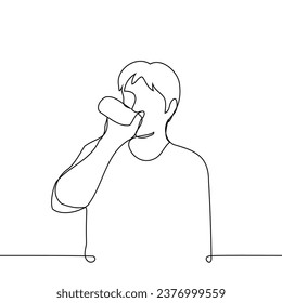 man stands and drinks from a metal can or small bottle - one line art vector. concept to quench thirst, bottled water, soda or energy drink