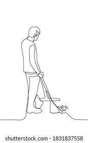 man stands in full growth and cleans the street. one line drawing of a man cleaner holding a broom and mop next to a pile of rubbish